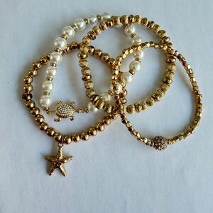 Lilly Pulitzer gold and pearl 4 bracelet set with starfish, turtle and crystal